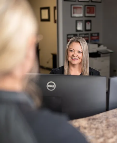Woman walking into hearing clinic