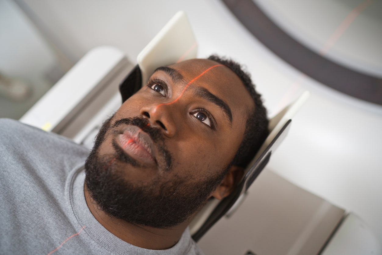 Man getting MRI to check for acoustic neuroma.