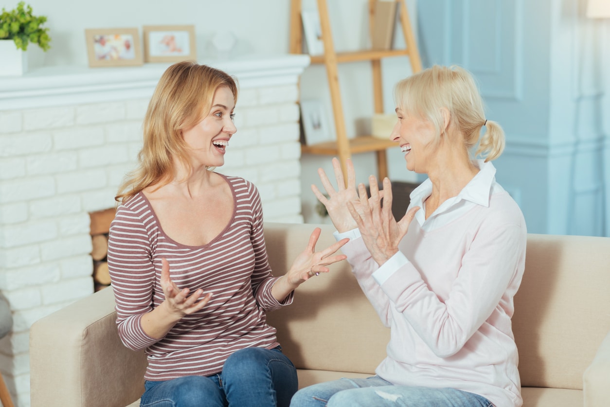Happy mother and daughter chat.
