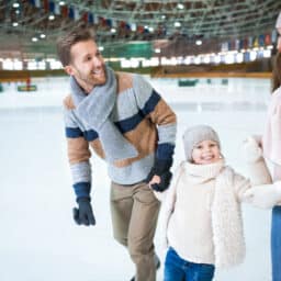 Happy man ice skating together