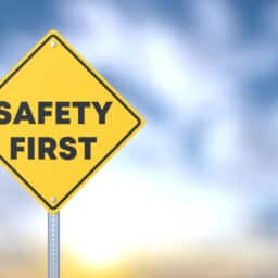 Yellow road sign saying Safety First