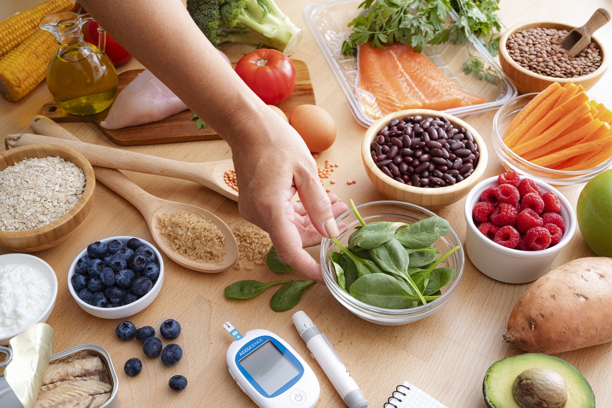 Group of healthy and fresh food recommended for lowering blood glucose levels in diabetic patients. unprocessed foods, plant-based foods and healthy fats.